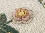 Hand-crocheted insect and floral tie-front polo knit shirt