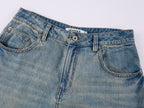 Insect and floral embroidered denim pants