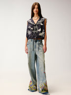 Insect and floral embroidered denim pants
