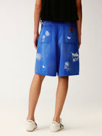 Lace insect and floral motif klein blue denim shorts