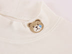 Petty Teddy Embroidered Mock Neck Top