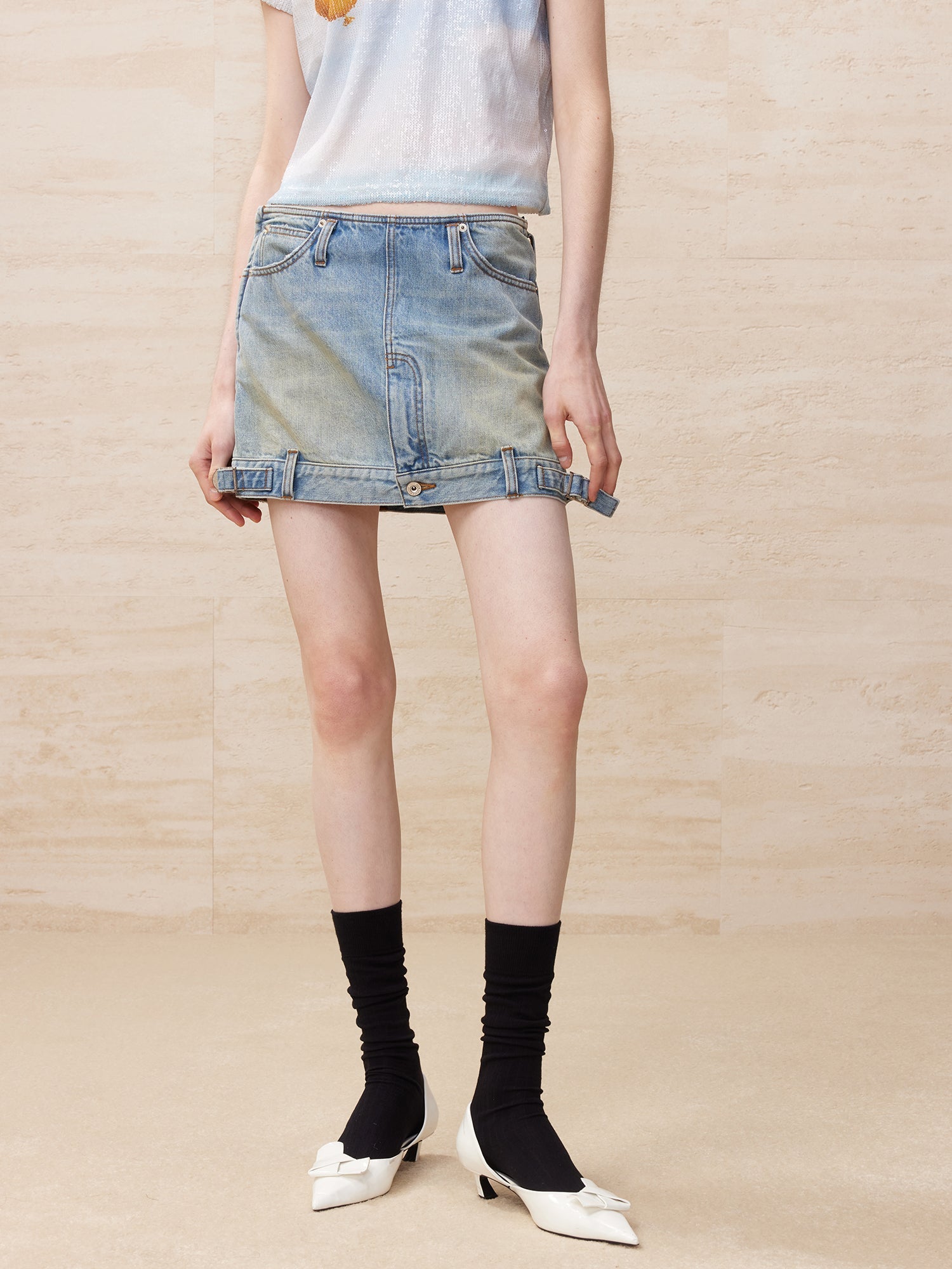 Deconstructed washed denim skirt